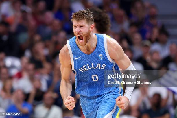 Thomas Walkup of Team Greece celebrates after scoring during the Men's Group Phase - Group A match between Team Australia and Team Greece on day...
