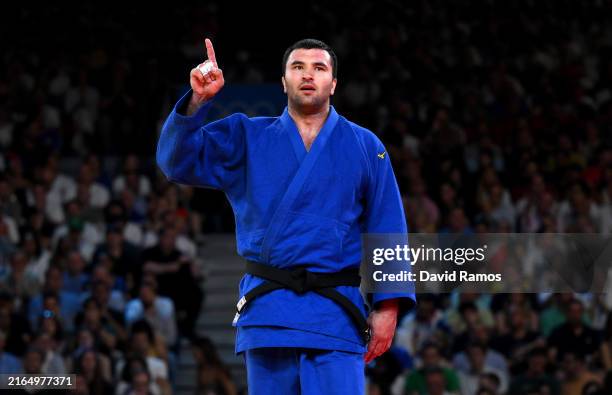 Temur Rakhimov of Team Tajikistan celebrates winning the bronze medal after his victory against Andy Granda of Team Cuba in the Judo Men +100kg...