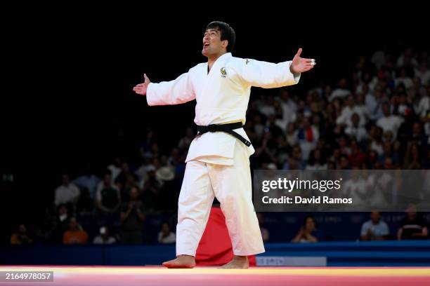Alisher Yusupov of Team Uzbekistan celebrates winning the bronze medal after his victory against Tatsuru Saito of Team Japan in the Judo Men +100kg...