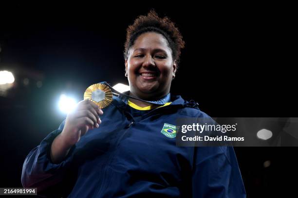 Gold medalist Beatriz Souza of Team Brazil poses on the podium after the Judo Women +78kg medal ceremony on day seven of the Olympic Games Paris 2024...