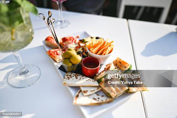 antipasto with summer cocktails close up. - snijplank stockfoto's en -beelden