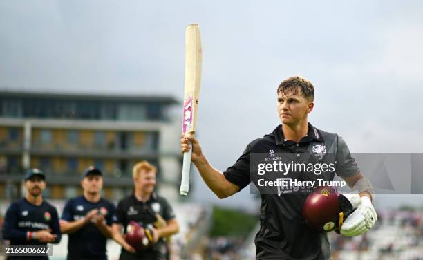 George Thomas of Somerset leads his side off after scoring an unbeaten century following the Metro Bank One Day Cup match between Somerset and...