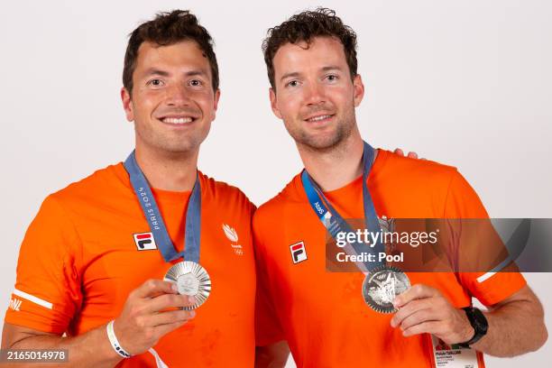 Netherland's men's double sculls silver medallists Stef Broenink and Melvin Twellaar pose for a portrait during a photo session at the Champions Park...