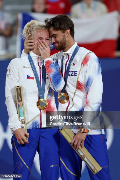 Gold medalists Katerina Siniakova and Tomas Machac of Team Czechia pose for a photo on the podium during the Tennis Mixed Doubles medal ceremony on...