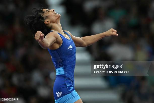 India's Vinesh Vinesh reacts to beating Japan's Yui Susaki in their women's freestle 50kg wrestling early rounds match at the Champ-de-Mars Arena...