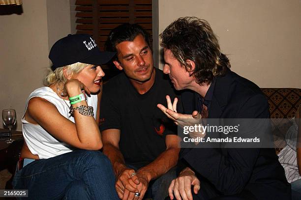 Singers Gwen Stefani and Gavin Rossdale chat with guitarist John Taylor at an after-party at the Chateau Marmont on July 15, 2003 in Hollywood,...