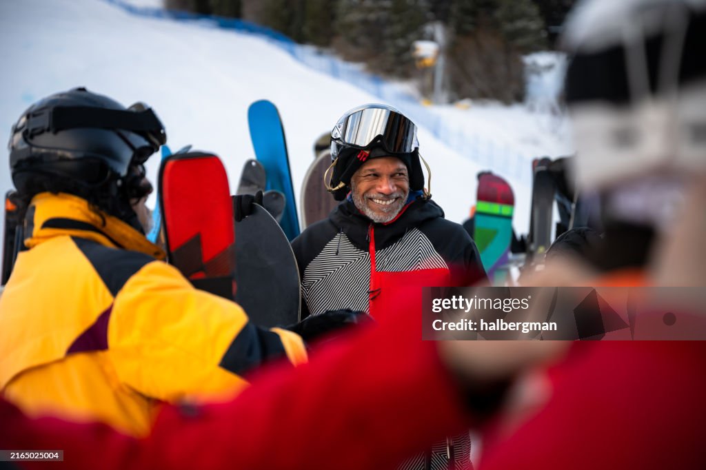 Grinning Man at Base of Ski Slope