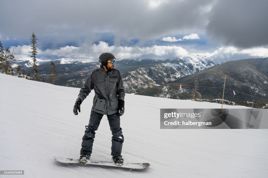 Black Man Snowboarding in Gorgeous Colorado Landscape