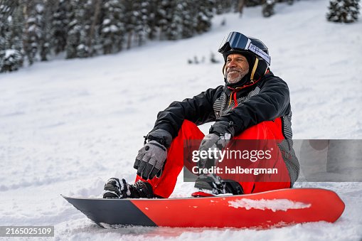 Grinning Older Snowboarder Taking a Rest Grinning Older Snowboarder Taking a Rest