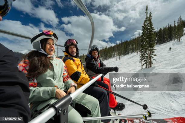 group selfie of friends riding ski lift - snowboarding pov stock pictures, royalty-free photos & images