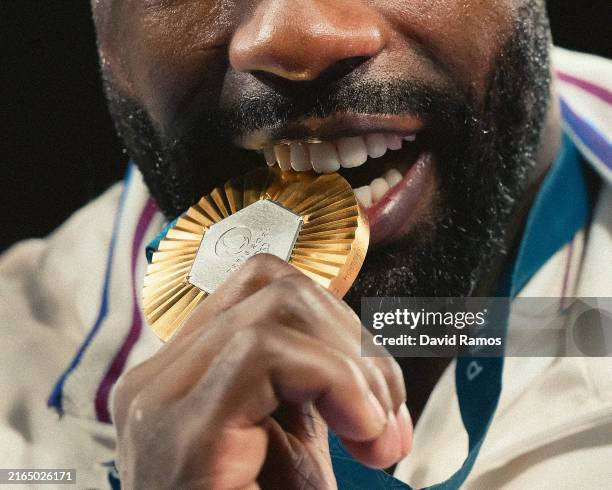 Gold medalist Teddy Riner of Team France bites his medal after the Judo Men’s +100kg Medal Ceremony on day seven of the Olympic Games Paris 2024 at...