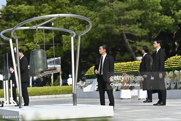 Security police take stand guard as Japan Prime Minister Fumio Kishida delivers a speech during the Peace Memorial Ceremony at the Peace Center...