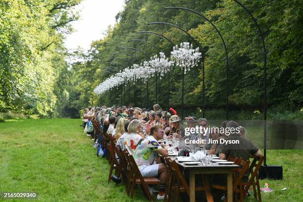 Diners attend Ben Quinn's Long Table Banquet In The Woods during Wilderness Festival 2024 at Cornbury Park on August 02, 2024 in Charlbury,...