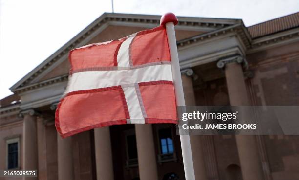 Danish flag flies in front of Copenhagen Court in central Copenhagen, Denmark, on August 6 as a Polish man accused of drunkenly punching Denmark's...