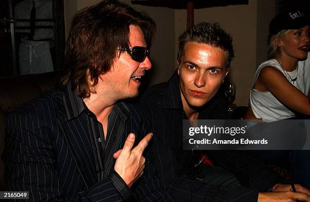 Guitarist Andy Taylor and his son Andy Jr. Pose at an after-party at the Chateau Marmont on July 15, 2003 in Hollywood, California. The party...