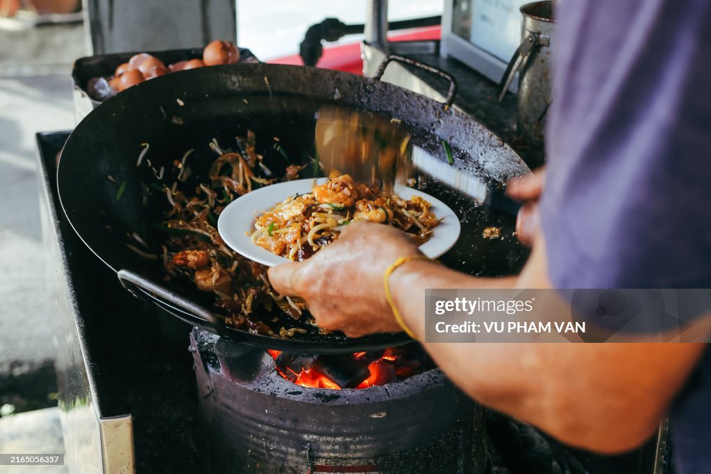 Cooking char kway teow in Penang, Malaysia