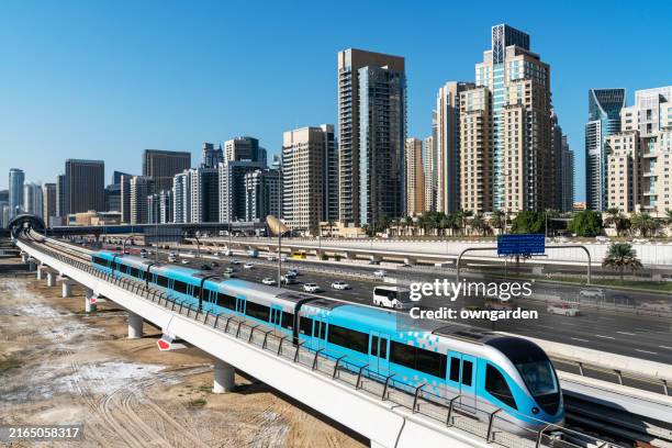 dubai traffic junction in downtown district - dubai metro stock pictures, royalty-free photos & images