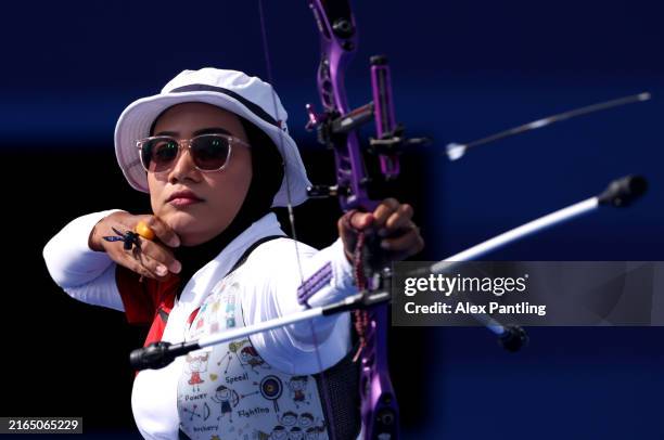 Diananda Choirunisa of Team Indonesia competes during the Women’s Individual 1/8 Elimination Round between Bhajan Kaur of Team India and Diananda...