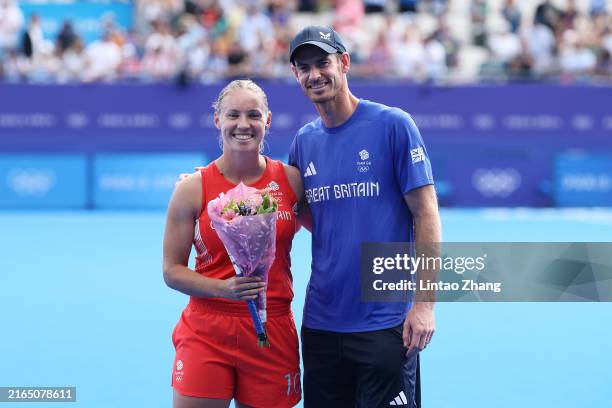 Sarah Robertson of Team Great Britain poses for a photo in a presentation with Andy Murray following the Women's Pool B match between Great Britain...