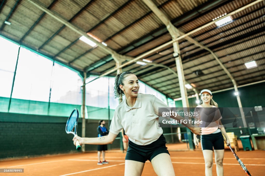 Female tennis player playing on a tennis court