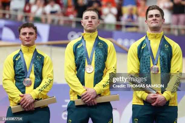 Australia's Matthew Richardson , Australia's Leigh Hoffman and Australia's Matthew Glaetzer celebrate their bronze medal on the podium after the...