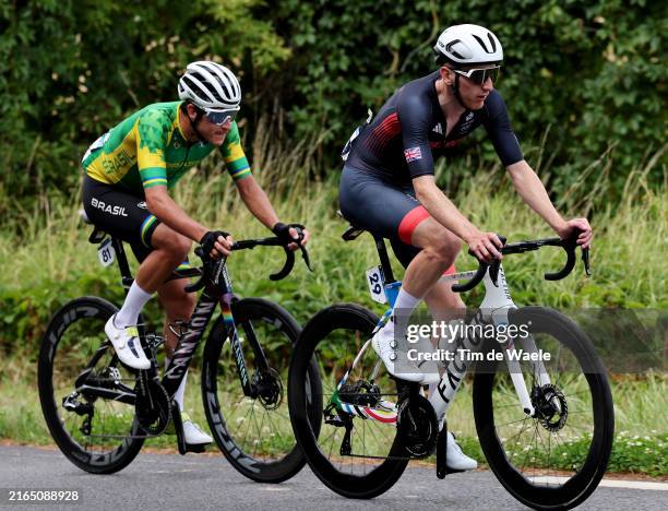 Vinicius Rangel of Team Brazil and Stephen Williams of Team Great Britain compete during the Men's Road Race on day eight of the Olympic Games Paris...