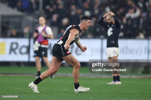 Scott Pendlebury of the Magpies celebrates on the final siren after winning the round 21 AFL match between Collingwood Magpies and Carlton Blues at...