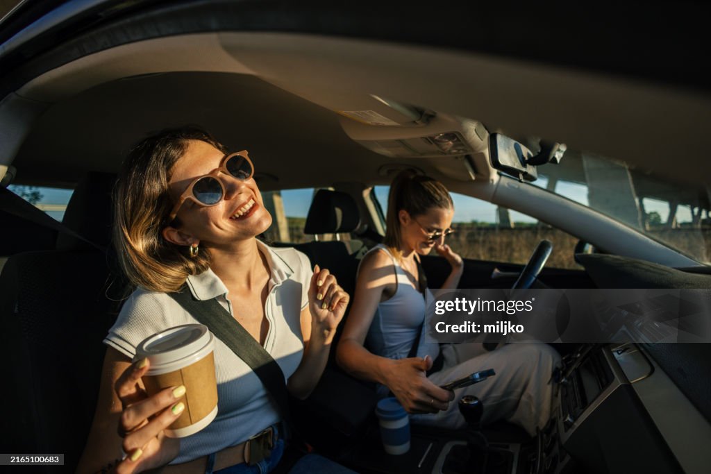 Two women in a car on a road trip