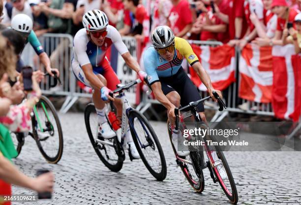 Valentin Madouas of Team France and Remco Evenepoel of Team Belgium compete in the breakaway passing through the Cote de la butte Montmartre during...
