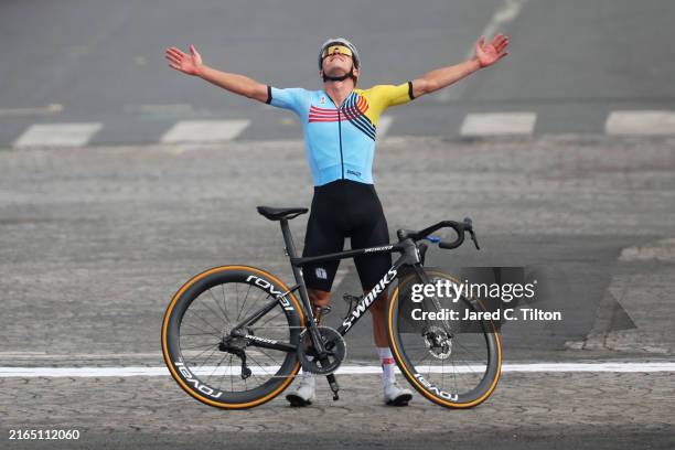 Remco Evenepoel of Team Belgium clebrates at finish line as Gold medal winner during the Men's Road Race on day eight of the Olympic Games Paris 2024...