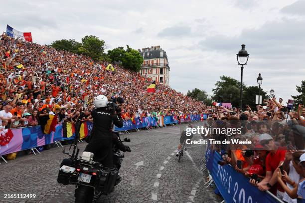 Remco Evenepoel of Team Belgium attacks in the breakaway passing through the Cote de la butte Montmartre while fans cheers during the Men's Road Race...