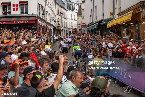 Cyclist compete passing through the Cote de la butte Montmartre while fans cheers during the Men's Road Race on day eight of the Olympic Games Paris...