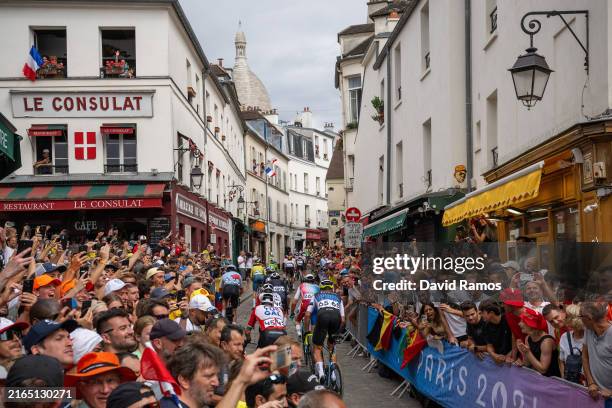 Cyclist compete passing through the Cote de la butte Montmartre while fans cheers during the Men's Road Race on day eight of the Olympic Games Paris...