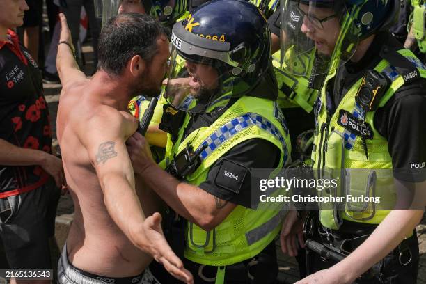 Police clash with right wing protesters in Piccadilly Gardens on August 3, 2024 in Manchester, United Kingdom. Mis-information spread on social media...