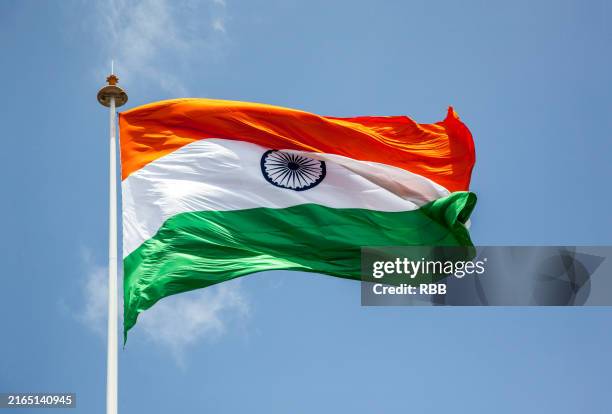 indian tricolor flag flying high in pune, india. - india flag stock pictures, royalty-free photos & images