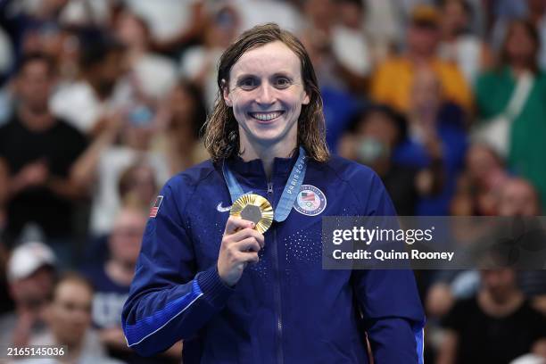 Gold Medalist Katie Ledecky of Team United States poses on the podium during the Swimming medal ceremony after the Women's 800m Freestyle Final on...