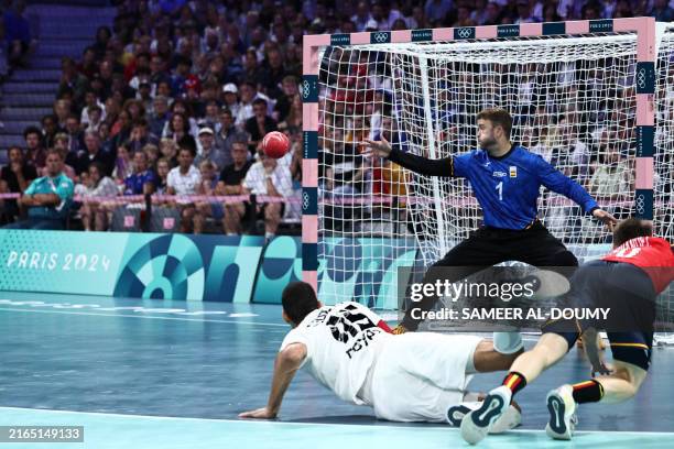 Spain's goalkeeper Gonzalo Perez De Vargas eyes the ball during the men's quarter-final handball match between Spain and Egypt of the Paris 2024...