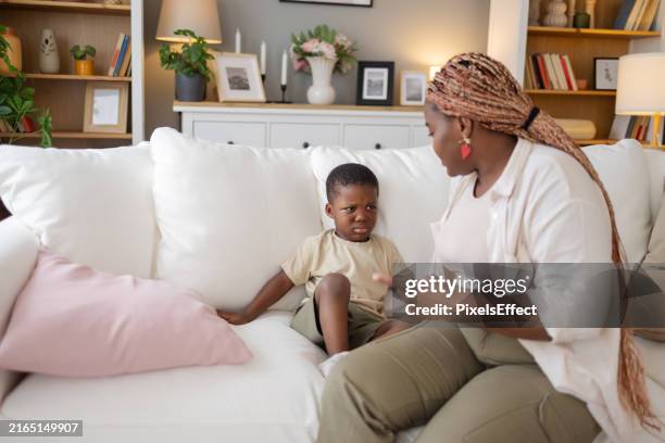 black mother scolds her little son at home - punishment stock pictures, royalty-free photos & images