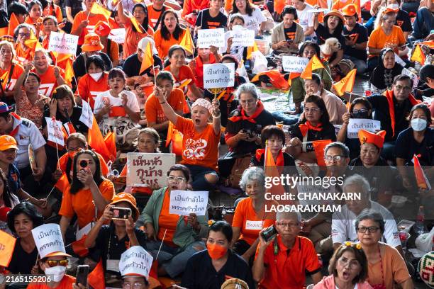 Supporters at the Move Forward Party headquarters react after Thailand's Constitutional Court ruled that former MFP leader Pita Limjaroenrat was to...