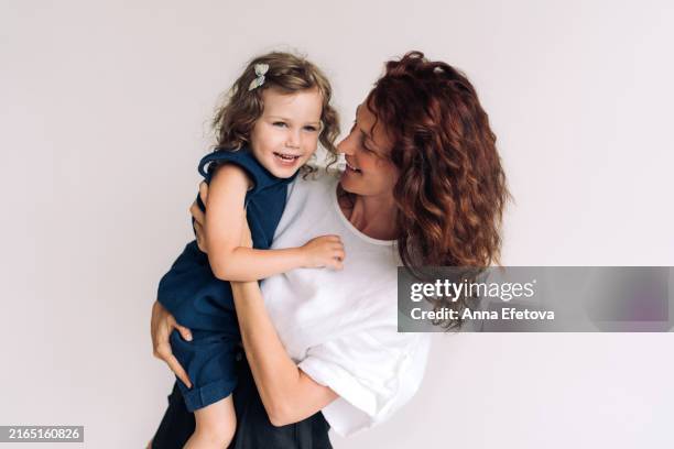 mother and daughter. mother's day concept - brown eyes stock pictures, royalty-free photos & images