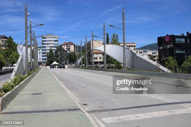 Police teams and Kosovo Force take security measures around the bridge as Serbs demonstrate to prevent the main bridge over the Ibre River from being...