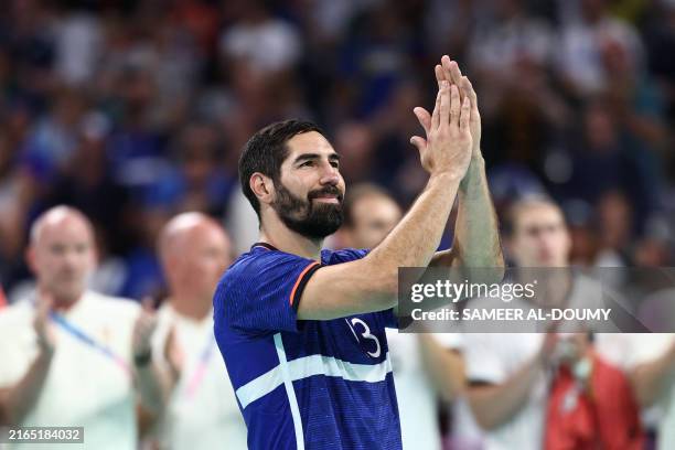 France's left back Nikola Karabatic reacts after being defeated by Germany at the end of the men's quarter-final handball match between Germany and...