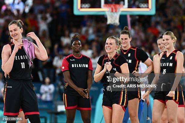 Belgium's Emma Meesseman , Belgium's Julie Vanloo and teammates celebrate at the end of the women's quarterfinal basketball match between Spain and...