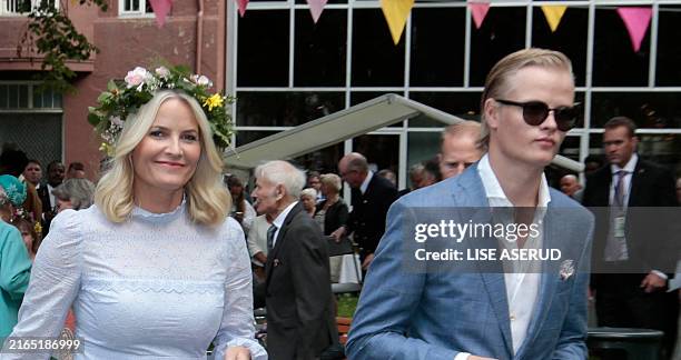 Picture taken on June 23, 2016 in Trondheim, Norway, shows Marius Borg Høiby next to his mother Norwegian Crown Princess Mette-Marit as they attend a...