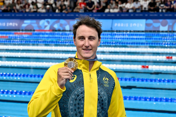 Cameron Mcevoy of Australia shows the gold medal after competing in the swimming 50m Freestyle Men Final during the Paris 2024 Olympic Games at La...