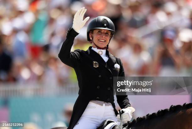 Jessica von Bredow-Werndl of Team Germany celebrates with horse TSF Dalera BB after their routine in the Dressage Individual Grand Prix Freestyle on...