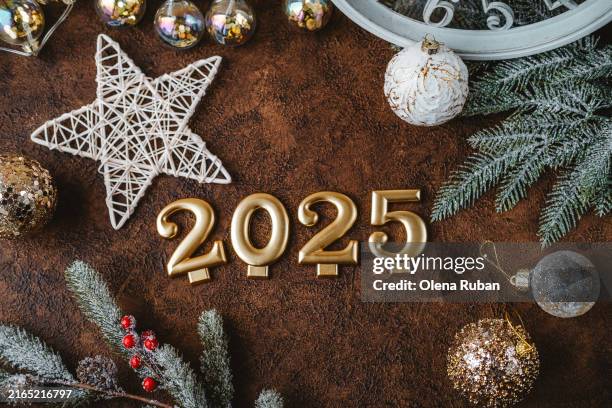 goldish 2025 among xmas attributes. - chinese astrology stock pictures, royalty-free photos & images