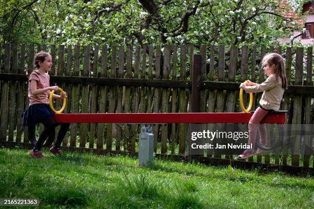 joy of balance on the seesaw - gungbräda bildbanksfoton och bilder