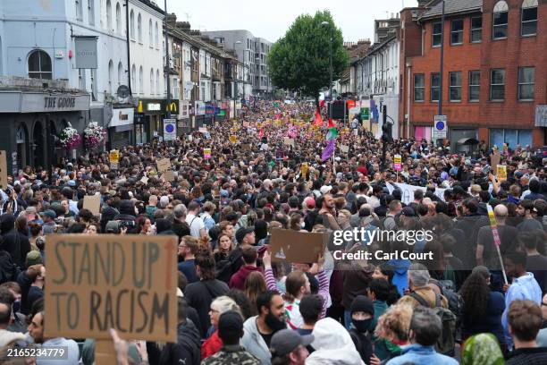Anti-racism counter protesters assemble ahead of a potential anti-immigration protest on August 7, 2024 in Walthamstow, United Kingdom. A series of...