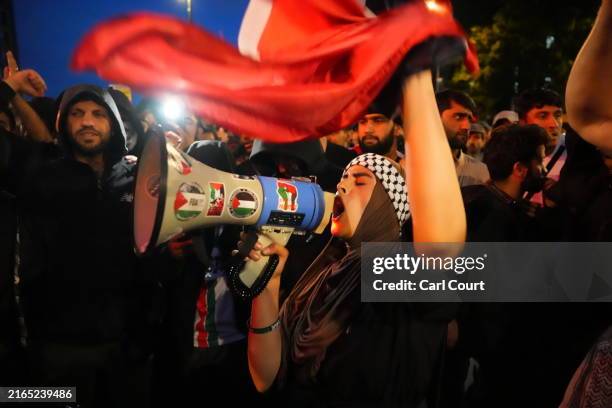 Anti-racism counter protesters chant as they gathered ahead of a potential anti-immigration protest on August 7, 2024 in Walthamstow, United Kingdom....